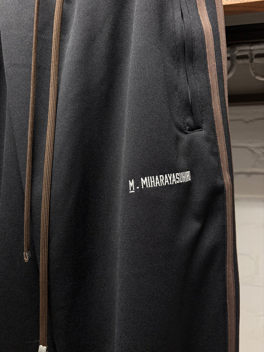 Mihara Yasuhiro ‘Twisted’ Black/Brown Striped Track Pants