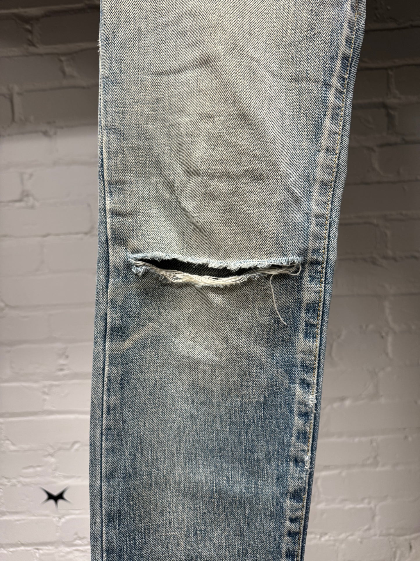 Saint Laurent ‘D02’ Distressed Light Wash Blue Skinny Jeans