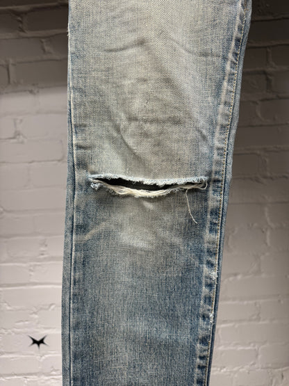 Saint Laurent ‘D02’ Distressed Light Wash Blue Skinny Jeans