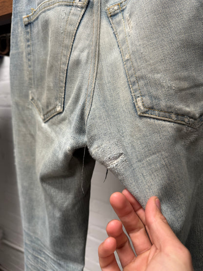 Saint Laurent ‘D02’ Distressed Light Wash Blue Skinny Jeans