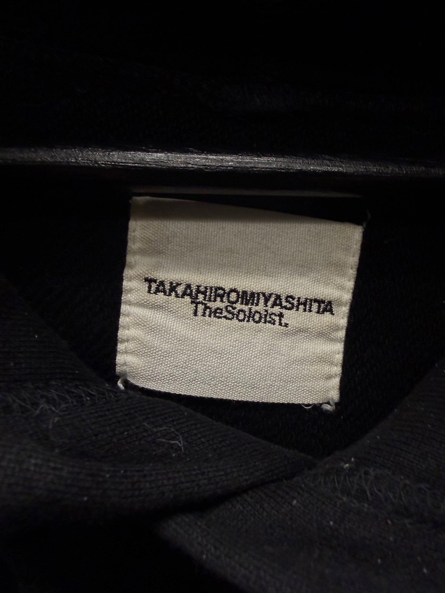 Takahiro Miyashita The Soloist ‘Design Language’ Blurred Text Black Pullover Hoodie