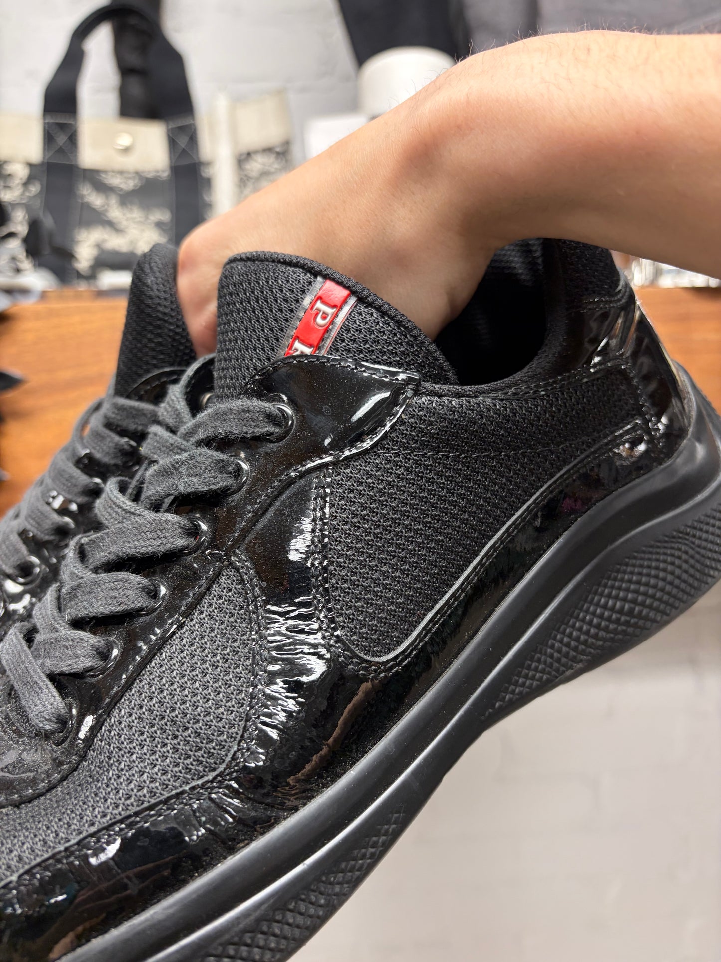 Prada ‘Americas Cup’ Black Patent Leather Low Top Sneakers