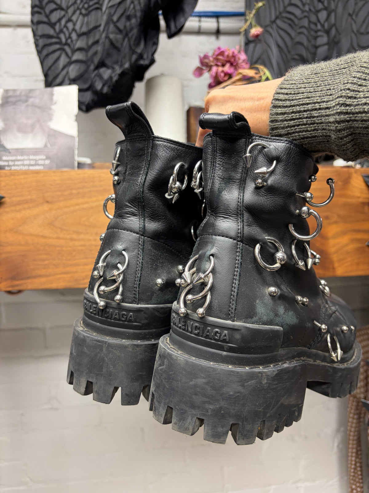 Balenciaga ‘Strike’ Piercing Distressed Black Leather Combat Boots