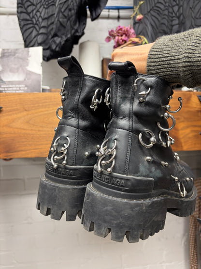 Balenciaga ‘Strike’ Piercing Distressed Black Leather Combat Boots