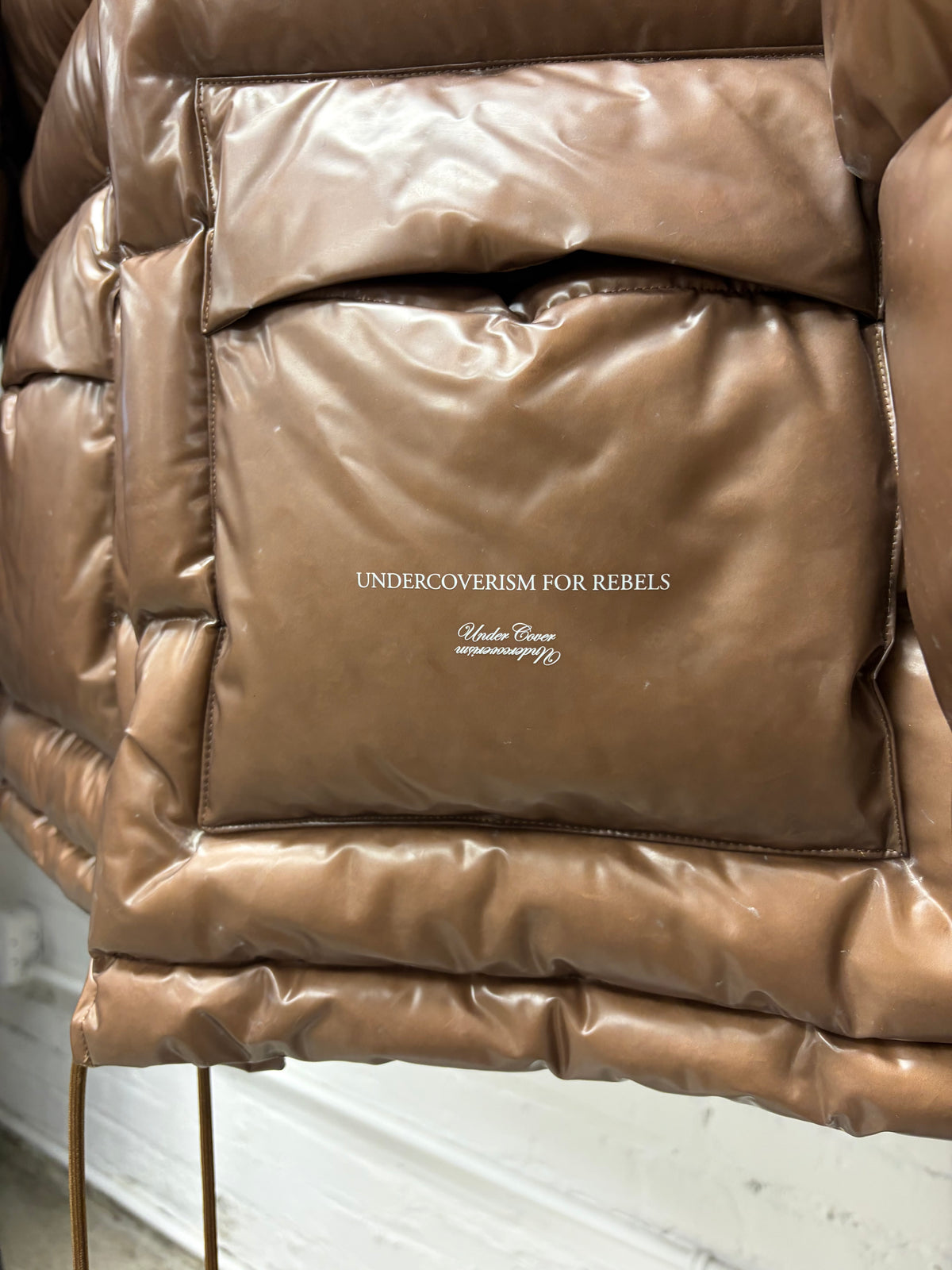 AW2021 Undercover ‘Secret Lab’ Brown Oversized Puffer Jacket