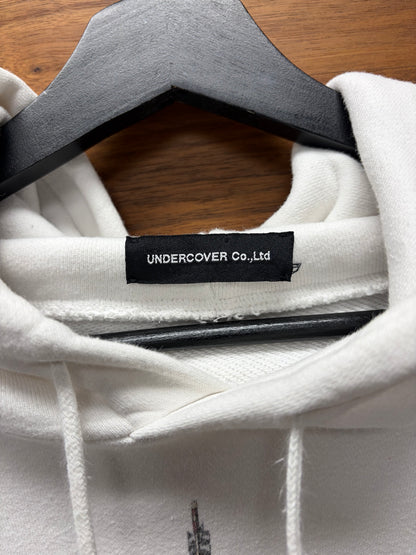 AW2020 Undercover ‘Fallen Man’ Arrow Rain White Graphic Hoodie
