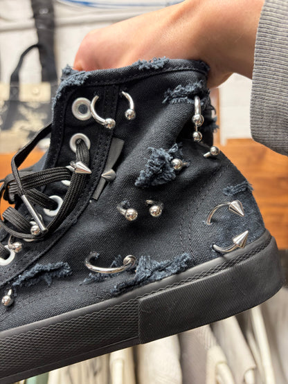 Balenciaga ‘Paris’ Pierced Black Canvas High Top Sneakers