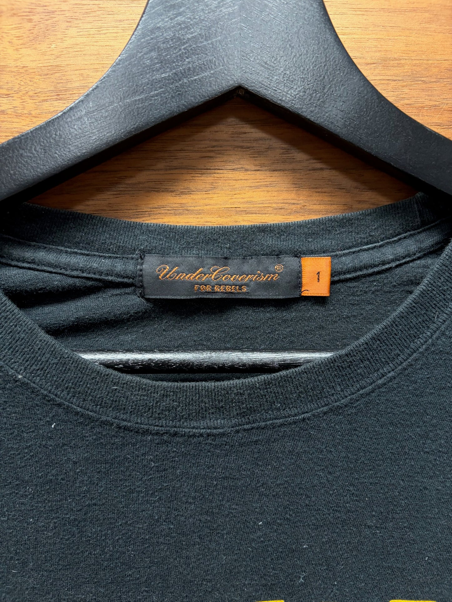 2000s Undercover ‘Nirvana’ Mirrored Logo Faded Black Graphic T-Shirt