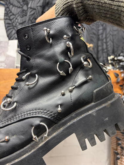Balenciaga ‘Strike’ Piercing Distressed Black Leather Combat Boots