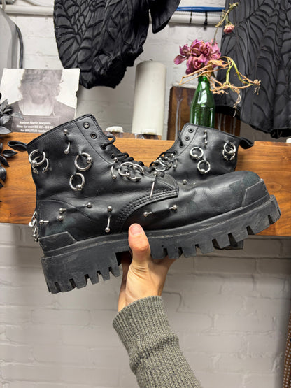 Balenciaga ‘Strike’ Piercing Distressed Black Leather Combat Boots