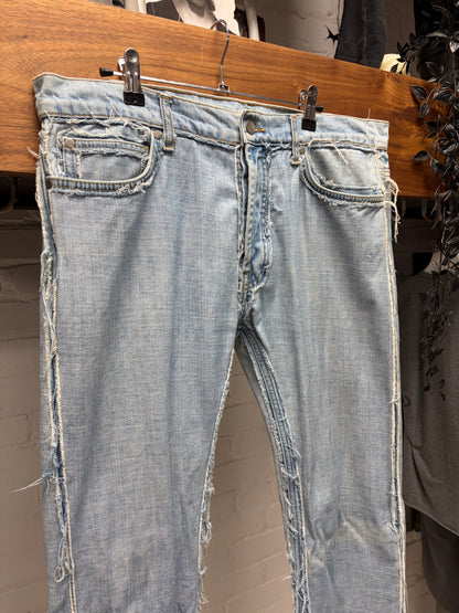 2012 Maison Margiela x H&M ‘Inside Out’ Raw Outseam Light Wash Blue Skinny Jeans