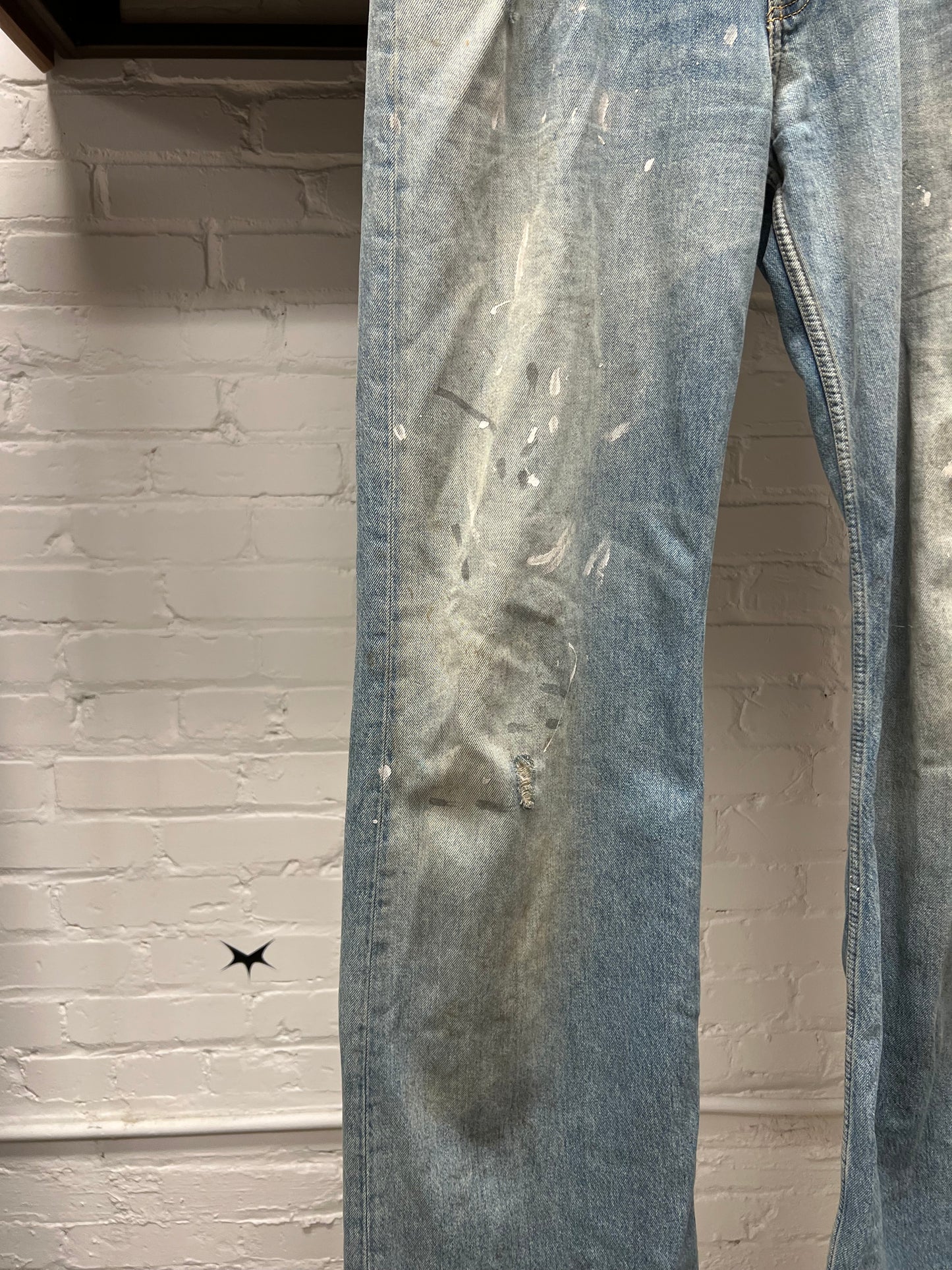 Acne Studios ‘Paint Splatter’ Light Wash Blue Flared Denim