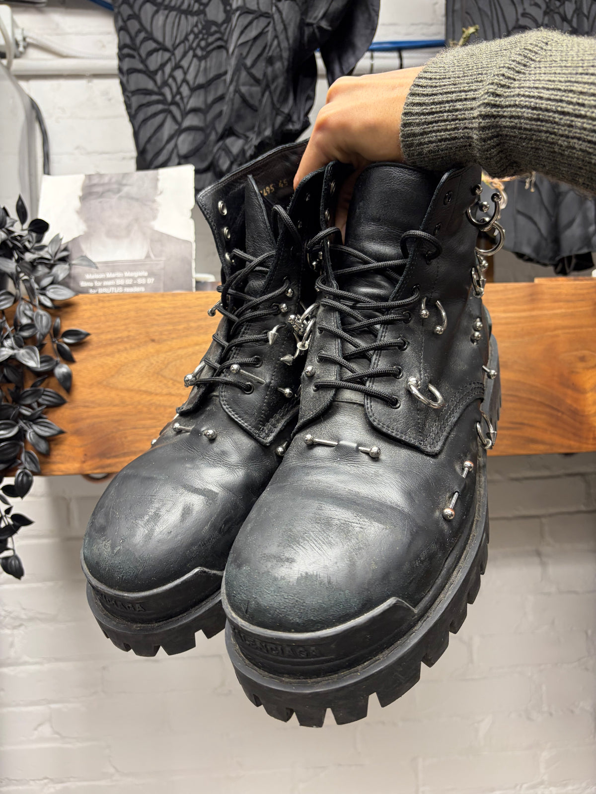 Balenciaga ‘Strike’ Piercing Distressed Black Leather Combat Boots